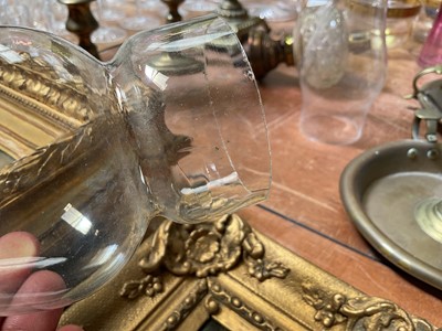 Lot 5119 - Three antique oil lamps with coloured glass shades, two of the burners by Gaudard France, and the other Kosmos, each approx 40cm high excluding chimneys, together with other oil lamp parts