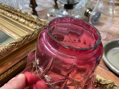 Lot 5119 - Three antique oil lamps with coloured glass shades, two of the burners by Gaudard France, and the other Kosmos, each approx 40cm high excluding chimneys, together with other oil lamp parts