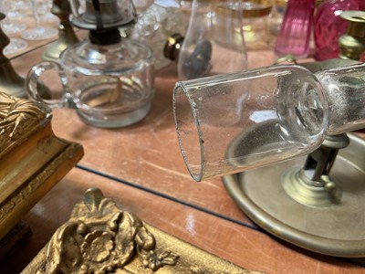 Lot 5119 - Three antique oil lamps with coloured glass shades, two of the burners by Gaudard France, and the other Kosmos, each approx 40cm high excluding chimneys, together with other oil lamp parts