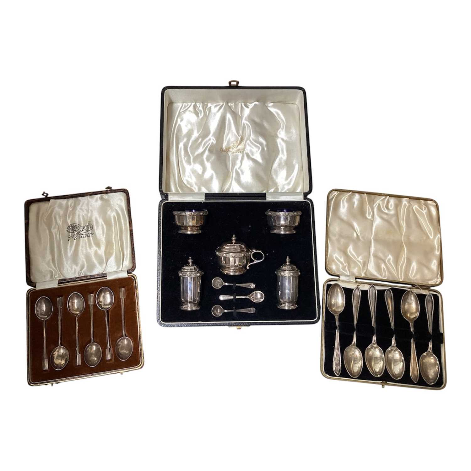Lot 5133 - Cased sterling silver cruet set, together with two cased sets of silver teaspoons
