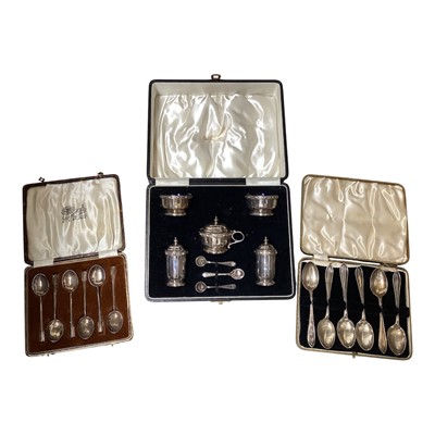 Lot 5133 - Cased sterling silver cruet set, together with two cased sets of silver teaspoons