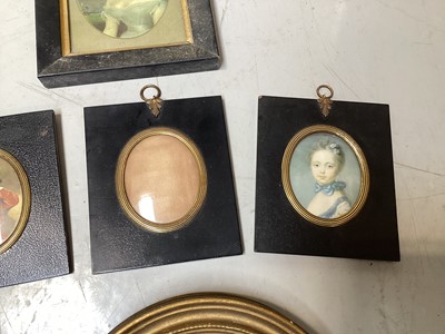 Lot 5134 - Three antique black lacquered portrait miniature frames, and two other frames, with prints