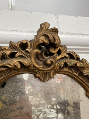 Lot 5176 - Oval gilt gesso wall mirror with scrolling foliage, 64cm x 47cm
