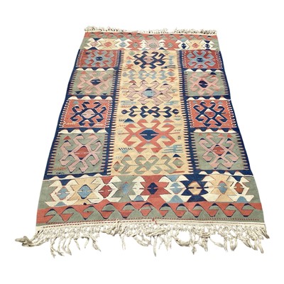 Lot 5360 - Kilim rug with geometric decoration on red, blue, cream, and green ground, 178cm x 114cm