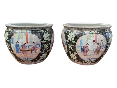 Lot 5245 - Pair of 20th century Chinese fishbowls, painted with figural panels on a floral ground, with Greek Key border, 37.5cm diameter x 31cm high