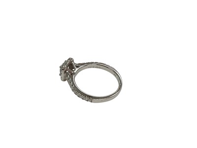 Lot 5 - Lab Grown Diamond Halo cluster ring with a central round brilliant cut Lab Grown diamond weighing 0.52ct, E colour and VVS2 clarity, surrounded by a border of further Lab Grown diamonds with fur...