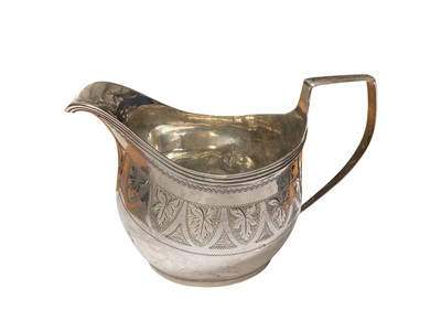 Lot 169 - George III silver cream jug with engraved bright cut foliate decoration, by William Bateman (London 1815), 13cm overall width
