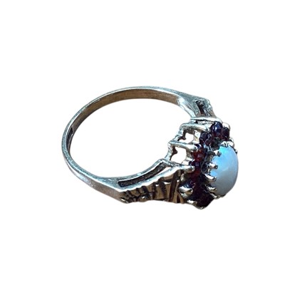 Lot 5185 - 9ct gold opal and garnet ring