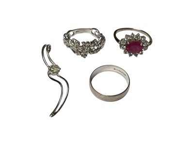 Lot 69 - Diamond single stone pendant, white gold diamond set floral design ring, 9ct gold wedding ring and a white metal gem set dress ring (4)
