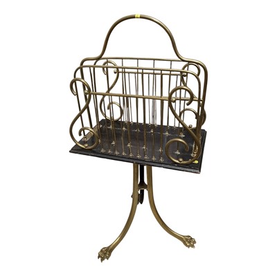 Lot 5220 - Victorian brass magazine rack with tripod stand and claw feet, 81cm tall