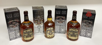 Lot 30 - Four bottles, Chivas Regal 12 year old Scotch whisky, 40%., 70cl, 75cl and two 1 litre bottles, each in original card boxes