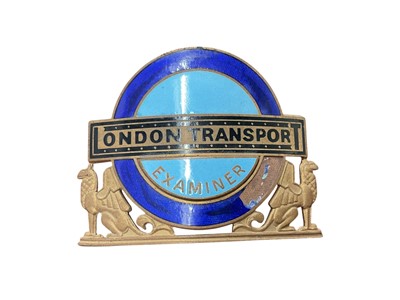 Lot Scarce vintage enamel London Transport Examiner badge, each 6cm in width.