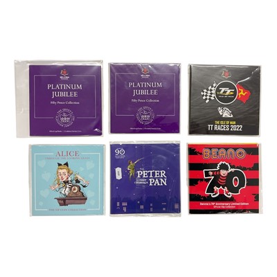 Lot 444 - World - Mixed uncirculated flatpack individual coins and coin sets issued by the Pobjoy Mint to include The Peter Pan 90th Anniversary 50 Pence collection 2020, pioneering women's suffrage 140th...