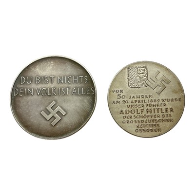 Lot 633 - Germany - Two silver Adolf Hitler commemorative medallions, Obvs: With bust of Hitler in relief facing left, to include .835 silver Hitlers 50th birthday 20th April 1939, born 1889 by Kri Schker...