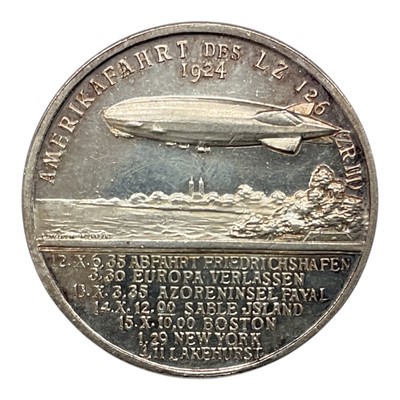 Lot 634 - Germany - A .990 silver medallion commemorating The Launch of Zeppelin LZ 126, reverse with portrait of Doctor Hugo Eckener by L. CHR. Lauer, Nuremberg 1924 (Dia: 33mm) (1 medallion)