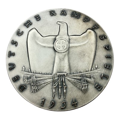 Lot 645 - Germany - A silvered bronze commemorative winners plaque for The German Fighting Games, Nurnberg Summer Games 23-29 June 1934 by O. Gloeckle (Dia: 88mm) (1 plaque)