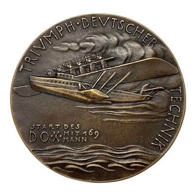 Lot 648 - Germany - A large bronze medallion commemorating Dr Claude Dornier, reverse 'The Triumph of German Technology', and depicting a Dornier Aircraft in flight 1929 by K. Goetz (Dia: 117mm) (1 medall...
