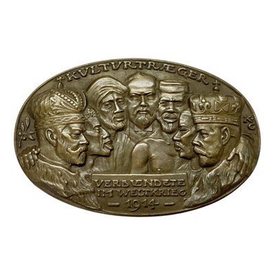 Lot 650 - Germany - An oval bronze commemorative medallion satirical and condemning The Allies for their use of Colonial Troops during World War I, the Obv: Depicts George V, Tsar Nicholas II and other Co...