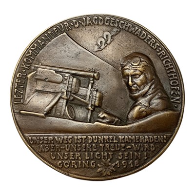 Lot 651 - Germany - A large bronze medallion commemorating Reichs Marshall Hermann Goring 1940, reverse depicts a young Goring piloting a plane in 1918 by K. Goetz (Dia: 111mm) (1 medallion)