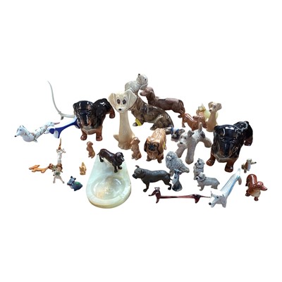 Lot 5019 - Bronze dachshund and onyx ashtray, a cold painted pug, and other dog ornaments including Beswick