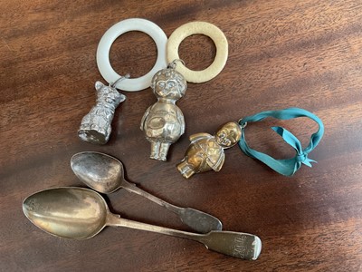 Lot 962 - Three babies teethers / rattles, including silver cat example, and two silver spoons (5)