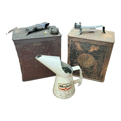 Lot 47 - Two Vintage Shell fuel cans, together with a Mobil oil pouring jug, (3).