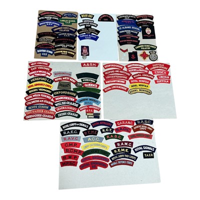 Lot 724 - Group of six boards, mounted with a selection British military cloth shoulder title badges, (6).