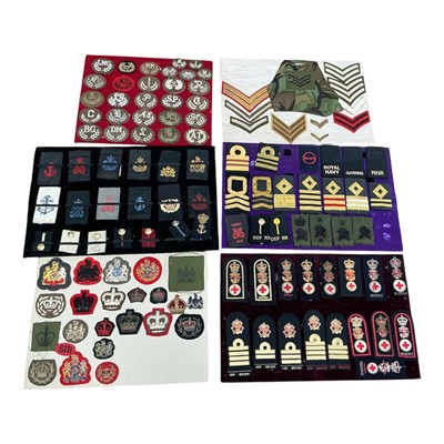 Lot 728 - Collection of British military cloth badges including epaulettes, mounted on boards, (6).