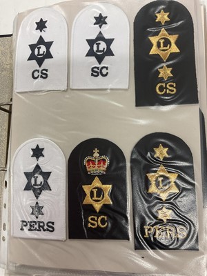 Lot 735 - Collection of mainly Royal Navy cloth badges, contained within a ring binder album.