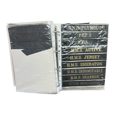 Lot 736 - Collection of Royal Navy cap tallies, contained within a ring binder album.