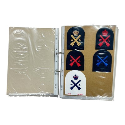 Lot 737 - Collection of mainly Royal Navy cloth badges, contained within a ring binder album.