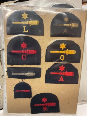 Lot 738 - Collection of mainly Royal Navy cloth badges, contained within a ring binder album.