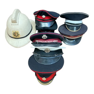 Lot 745 - Group of assorted hats and helmets to include East Ham Fire Brigade, City of Norwich Fire Bridge, Salvation Army and others, (1 box).