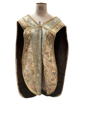 Lot 2579 - Antique Chasuble with a central panel of embroidered silk, surrounded by finely embroidered cream silk with scrolling flowers reminiscent of Jacobean crewelwork. Plus a small altar cloth.