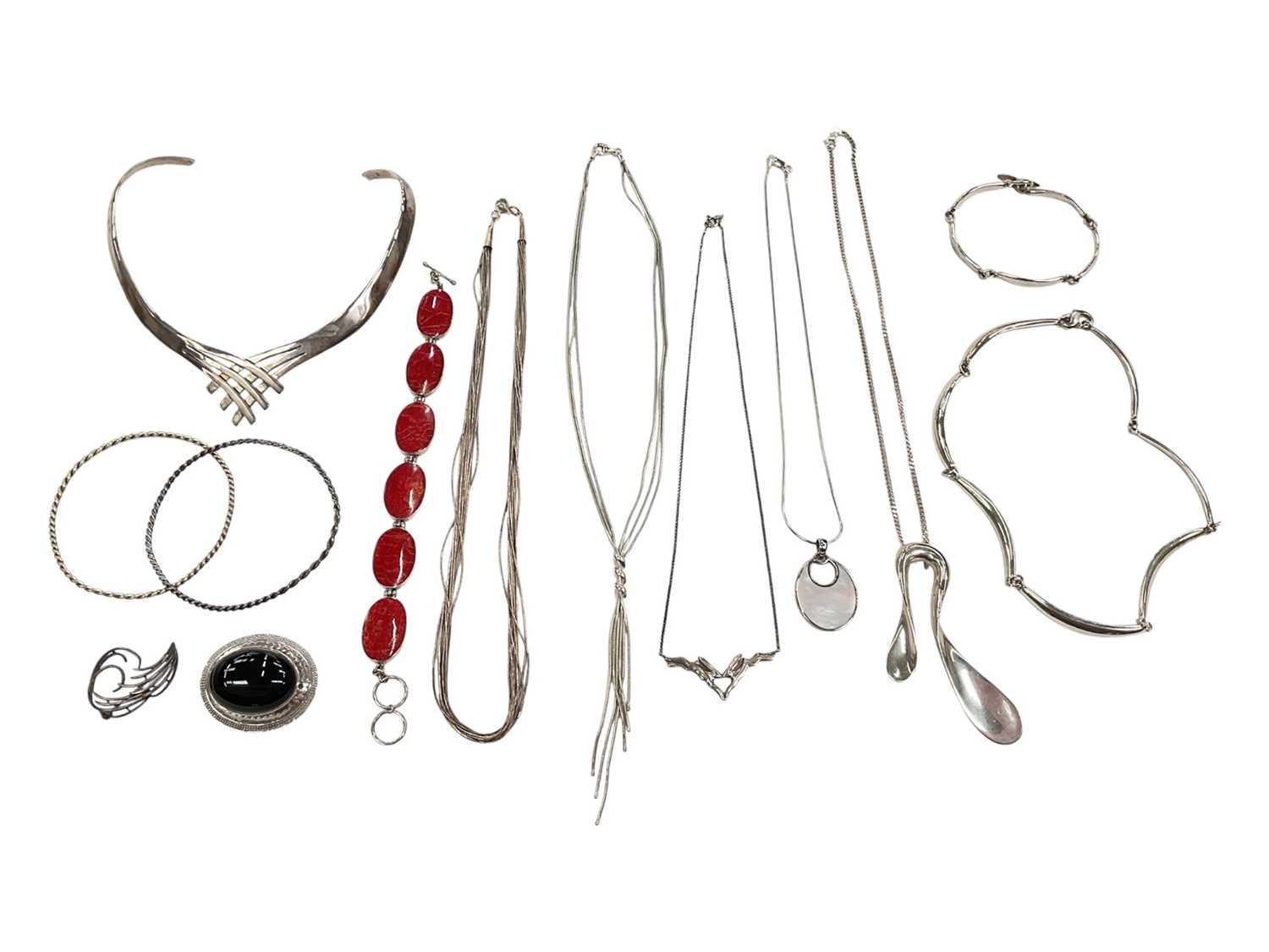 Lot 28 - Group of silver jewellery including an abstract torque necklace, other necklaces, bracelets, brooches and two white metal bangles