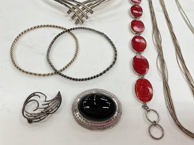 Lot 28 - Group of silver jewellery including an abstract torque necklace, other necklaces, bracelets, brooches and two white metal bangles