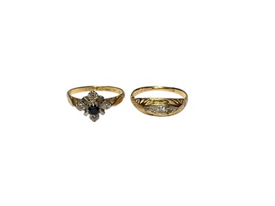 Lot 29 - 18ct gold sapphire and diamond cluster ring and 18ct gold diamond four stone ring (2)