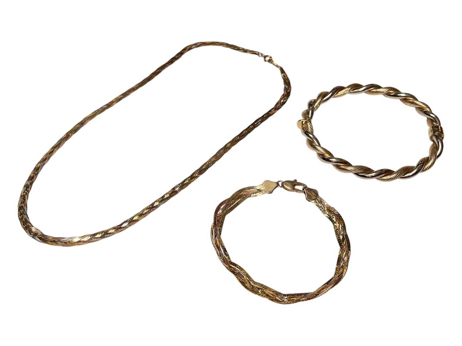 Lot 32 - 9ct two colour gold twisted bangle, together with a 9ct three colour gold necklace and bracelet (3)