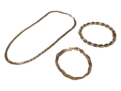 Lot 32 - 9ct two colour gold twisted bangle, together with a 9ct three colour gold necklace and bracelet (3)