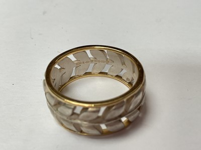 Lot 34 - Contemporary silver and 18ct gold pierced leaf design ring and two other silver rings, all the same maker EJS.