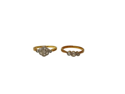 Lot 54 - 18ct gold diamond flower head cluster ring and 18ct gold diamond three stone ring (2)