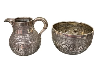 Lot 186 - Victorian silver milk jug and sugar bowl both with embossed zodiac signs and engraved scroll decoration (London 1873)