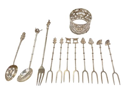 Lot 119 - Chinese silver napkin ring with pierced dragon decoration, together with set of eight Chinese sterling silver two pronged forks and other Chinese silver and white metal flatware