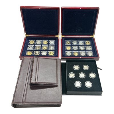 Lot 457 - World - In two wood cases, London Mint Office 'The Millionaires Coin Collection' .925 silver