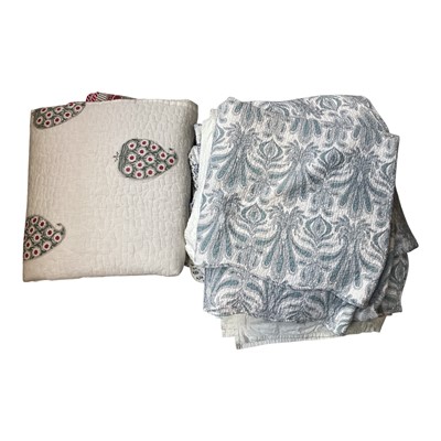 Lot 5125 - Four quilted bedcovers including one with cut-work flowers.