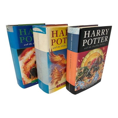 Lot 1308 - Three First Edition Harry Potter books to include the Half-Blood Prince with rare page 99 printing error with the misprint 'eleven owls'. Order of The Phoenix and Deathly Hallows (3)