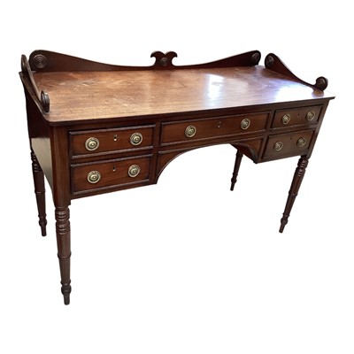 Lot 5300 - Regency mahogany kneehole desk with scroll ledge back, five drawers on ring turned legs