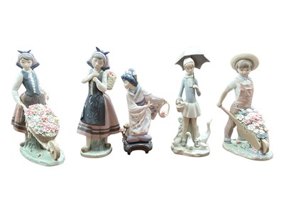 Lot 2228 - Five Lladro porcelain figures including A Barrel of Blossoms (one boxed)