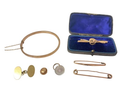 Lot 98 - Group of gold jewellery to include 9ct gold bangle, two 9ct gold bar brooches, one other yellow metal brooch, two 15ct gold studs and one 18ct gold cufflink