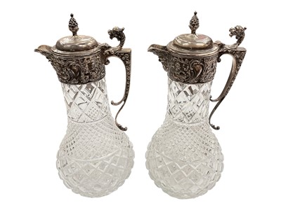 Lot 124 - Pair of good quality contemporary silver mounted cut glass claret jugs.